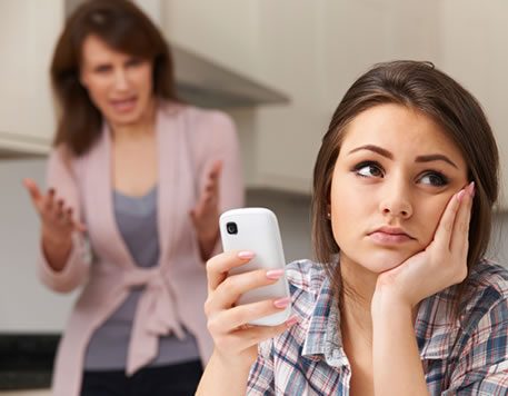 mother arguing with teenage daughter